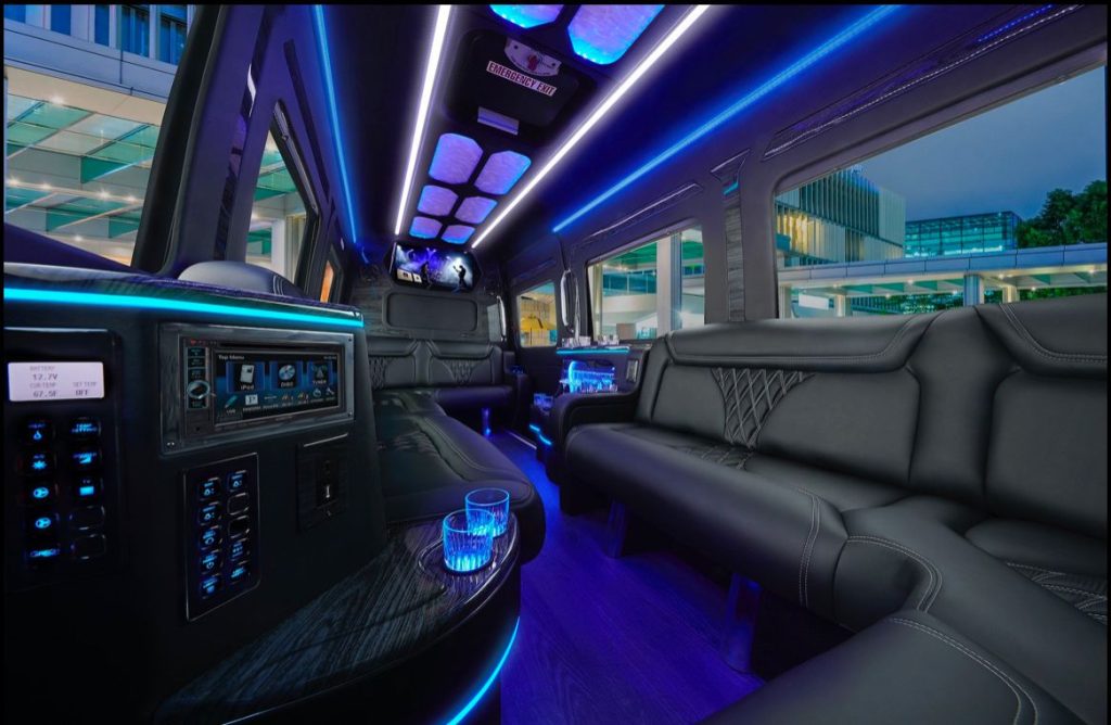 Loveland Limousine Service 6 Limousine interior showing all-black leather seats and entertainment center.